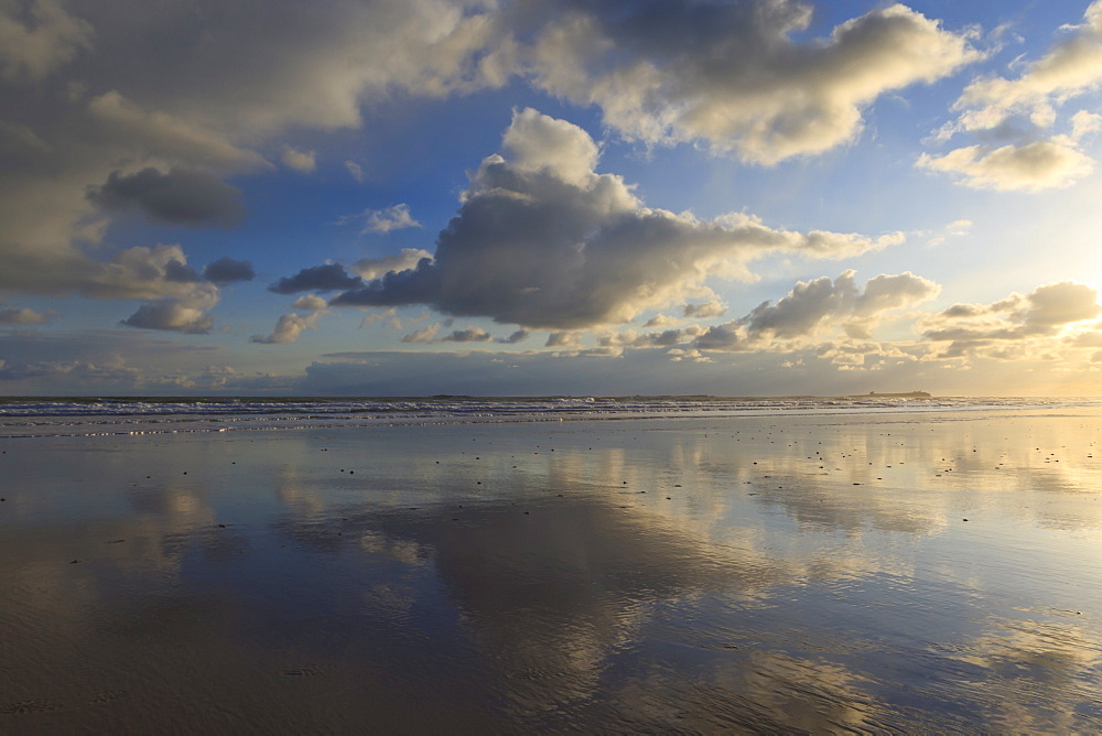 Farne Islands reflections, from Bamburgh beach, Bamburgh, Northumberland, England, United Kingdom, Europe