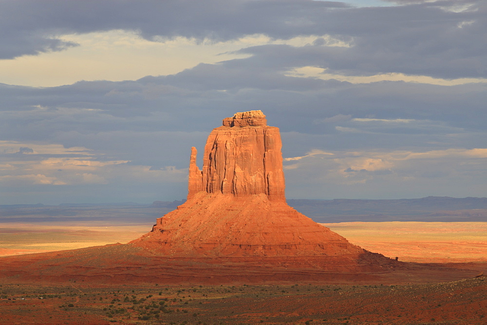 Mitten at dusk lit by late evening sun, Monument Valley Navajo Tribal Park, Utah Arizona border, United States of America, North America