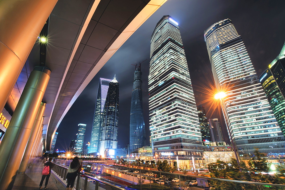 Wide angle view of ultra modern architecture in Shanghai Pudong at night, Shanghai, China, Asia