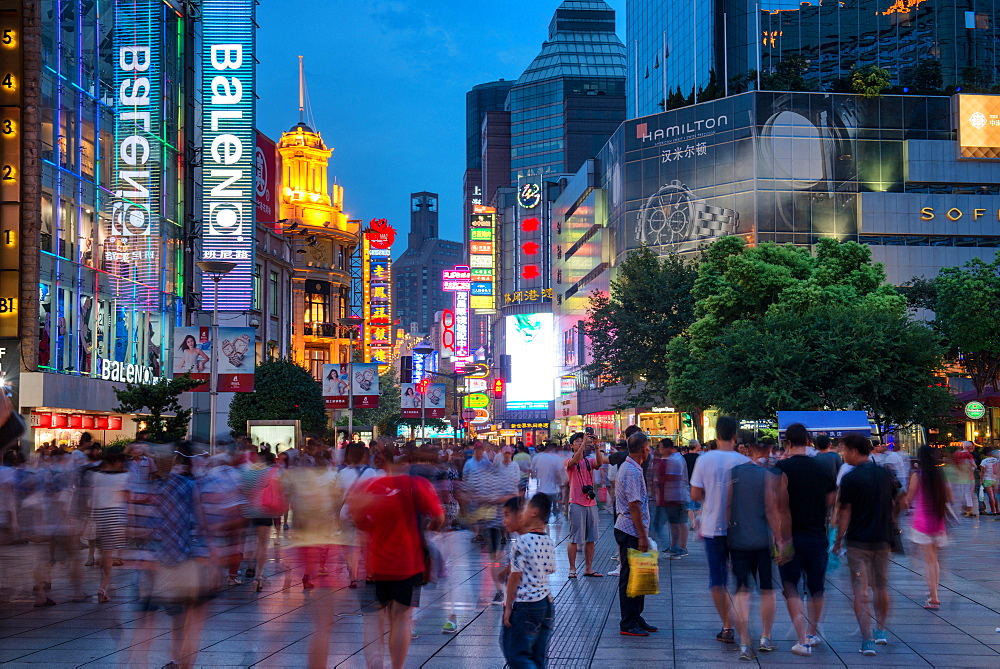 Blue hour shot of Nanjing Lu in Shanghai with visitors and LED illuminations, Shanghai, China, Asia 