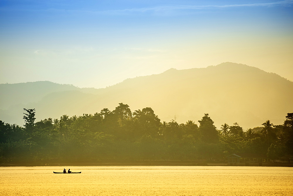 A local fisherman in a traditional canoe, Banda, Maluku, Spice Islands, Indonesia, Southeast Asia, Asia