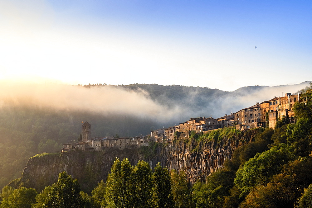 The clifftop village of Castellfollit de la Roca in the morning light, Garrotxa, Girona, Catalonia, Spain, Europe