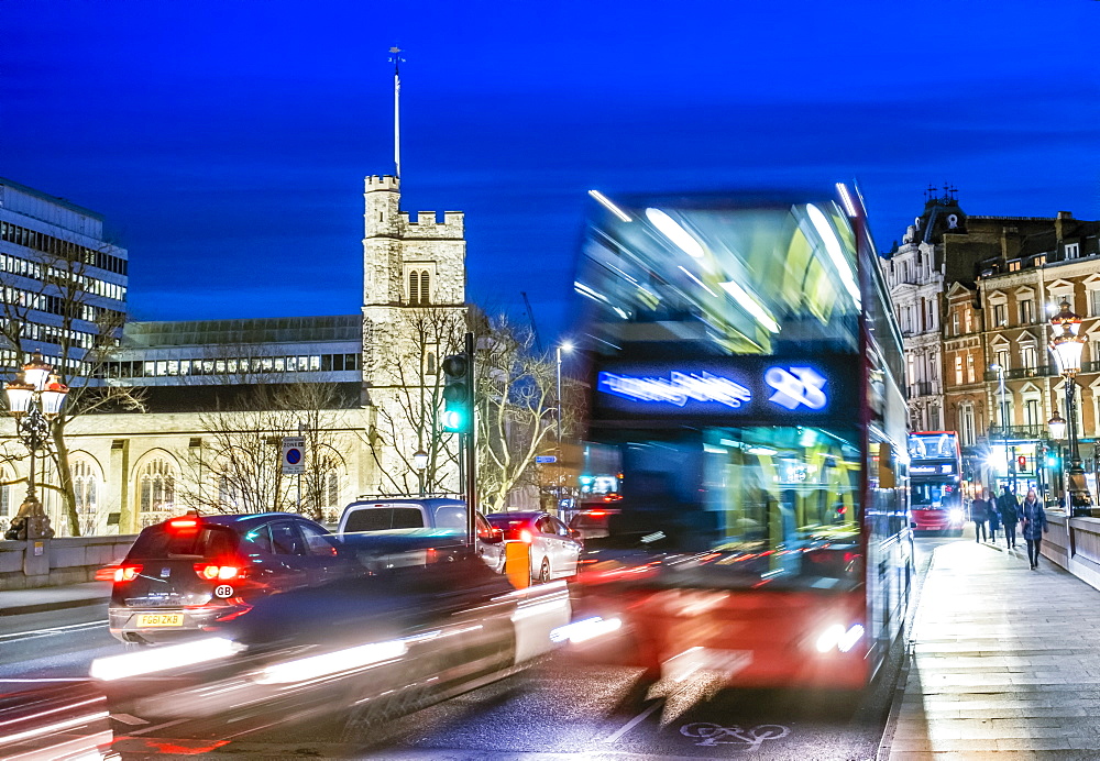 A London double-decker bus in moving traffic on Putney Bridge in the early evening, London, England, United Kingdom, Europe