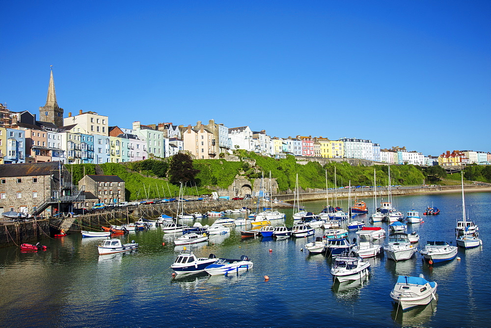 View of the town centre and fishing boats in the harbour, Tenby, Pembrokeshire, Wales, United Kingdom, Europe