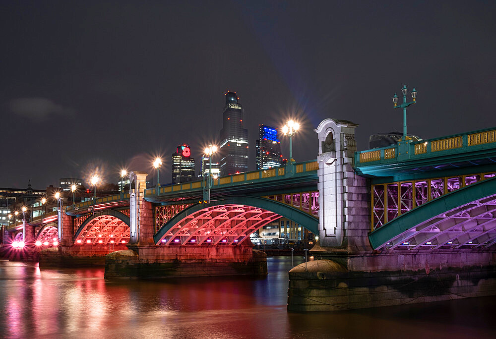 Southwark Bridge at night with illuminated buildings of the City of London financial district, Southwark, London, England, United Kingdom, Europe