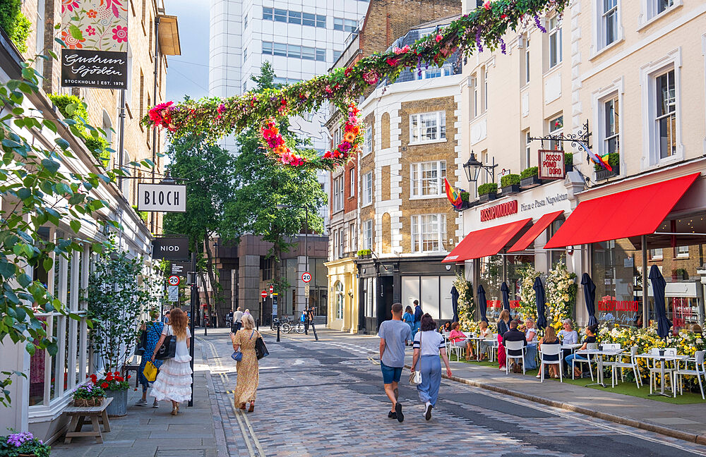 Restaurants and pedestrians on Monmouth Street, a shopping street near Seven Dials, Covent Garden, West End, London, England, United Kingdom, Europe