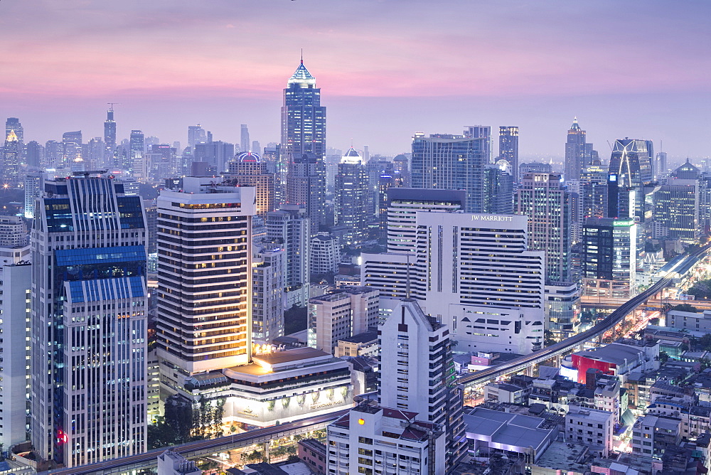 City skyline looking along the BTS Skytrain, Sukhumvit Road and Phloen Chit to Phloen Chit station, Bangkok, Thailand, Southeast Asia, Asia