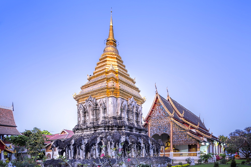 Elephant sculptures on the Chedi Chang Lom and the main bot at the temple of Wat Chiang Man, Chiang Mai, Thailand, Southeast Asia, Asia