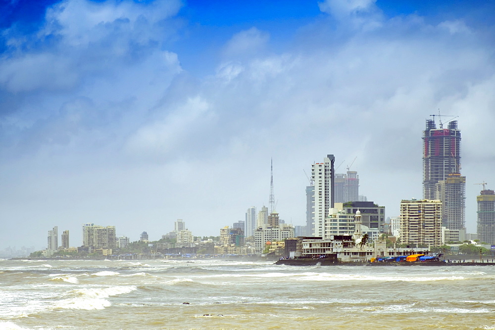 The Haji Ali mosque and the skyline of central Mumbai under monsoon seas, Mumbai (Bombay), Maharashtra, India, Asia