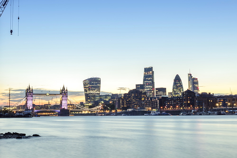 Skyline of the City of London and Tower Bridge at twilight shot from Bermondsey, London, England, United Kingdom, Europe