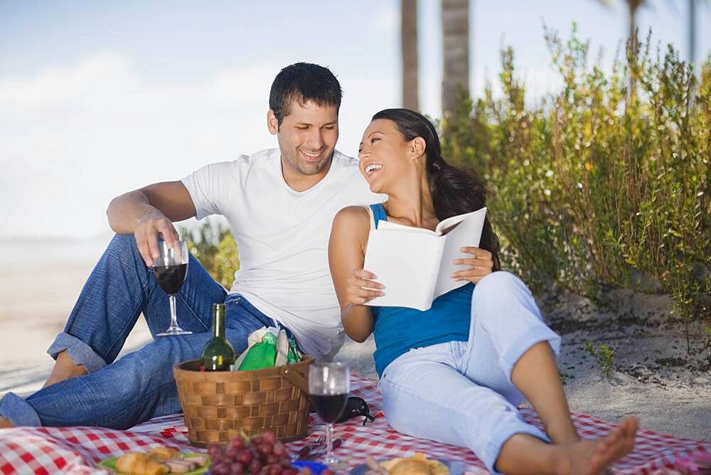 Hispanic couple having picnic