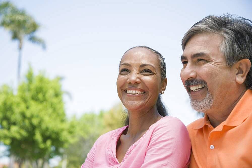 Multi-ethnic couple laughing