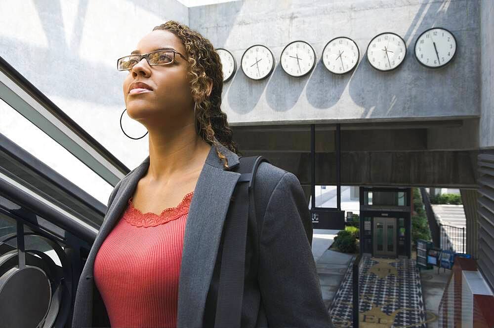 African businesswoman in train station