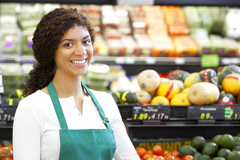 Mixed Race clerk in grocery store