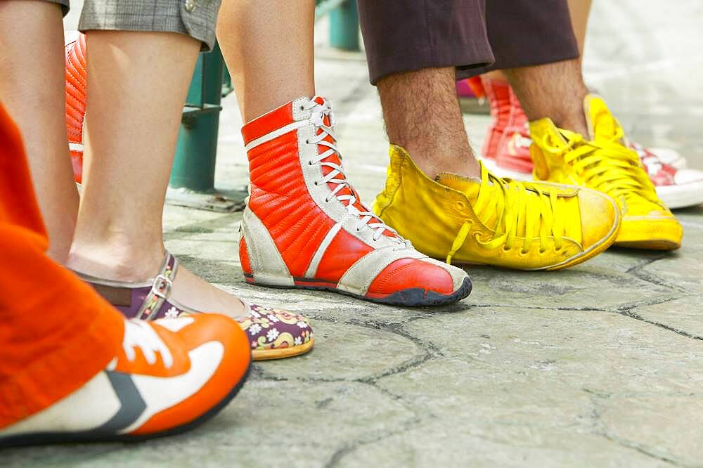 Close up of group of young people's feet with funky shoes