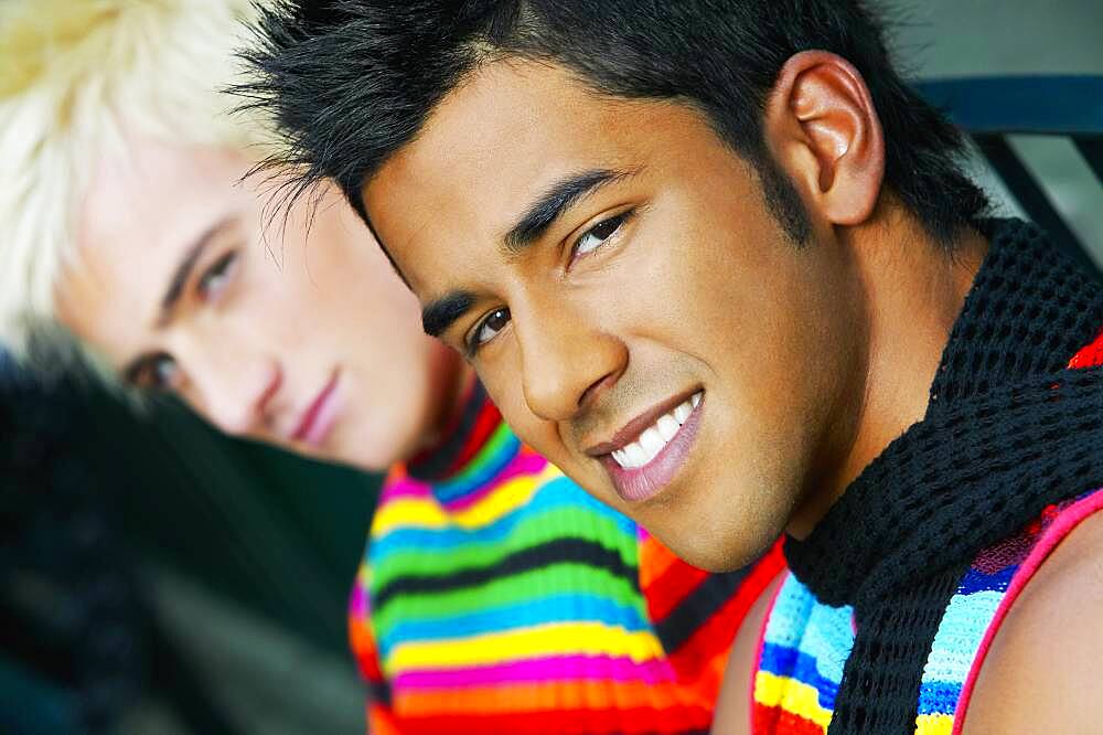 Hispanic teenage boy with friend in background