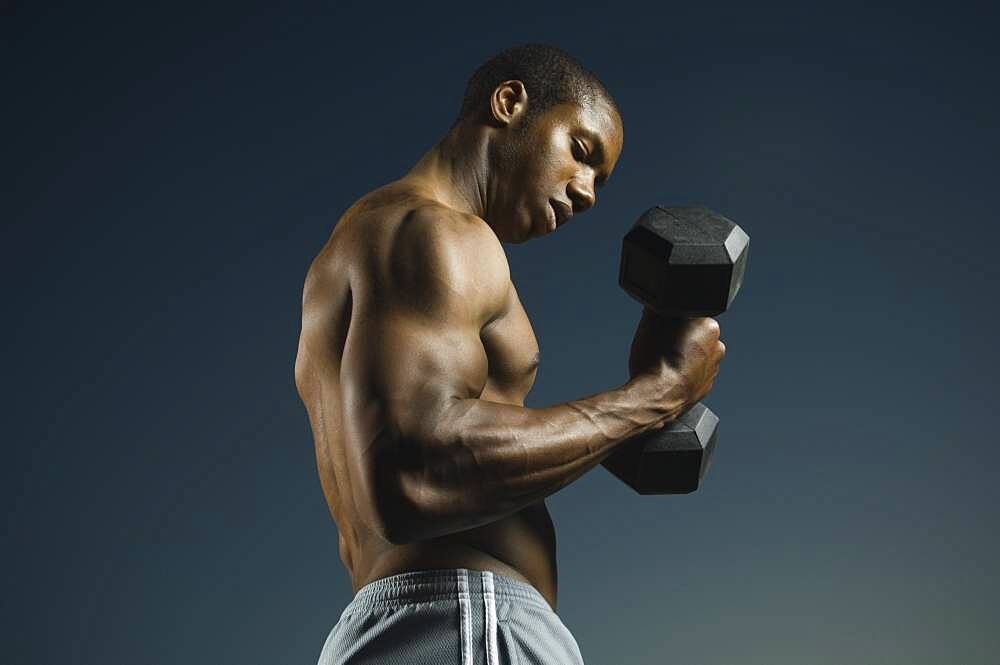 African American man lifting weights