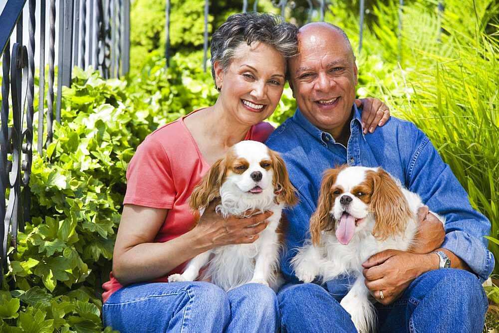 Senior African American couple with dogs