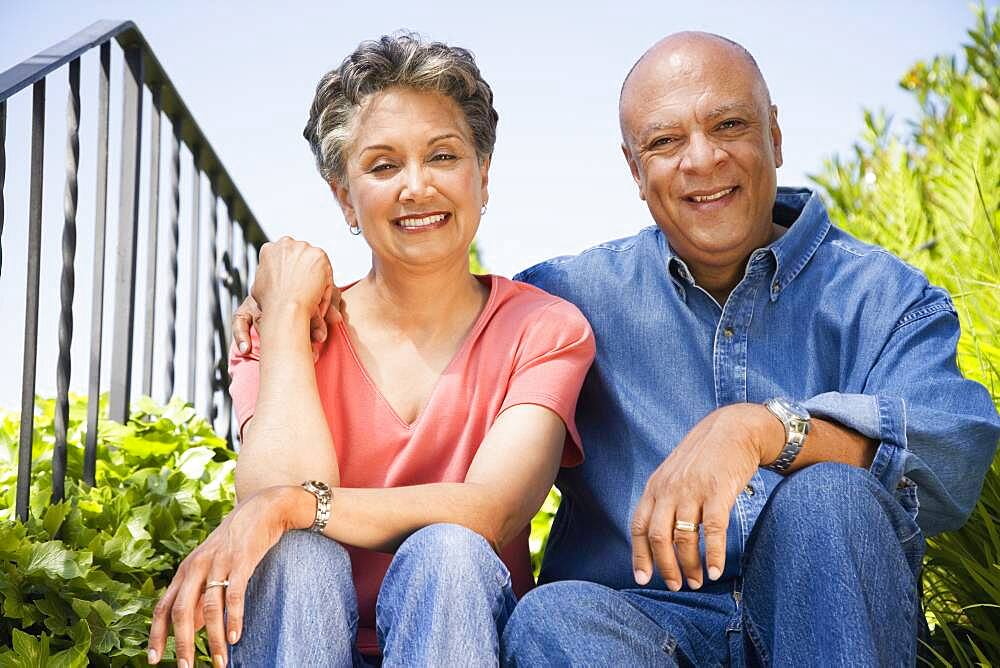 Senior African American couple hugging