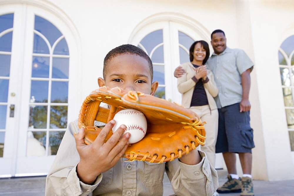 African American boy with baseball and glove