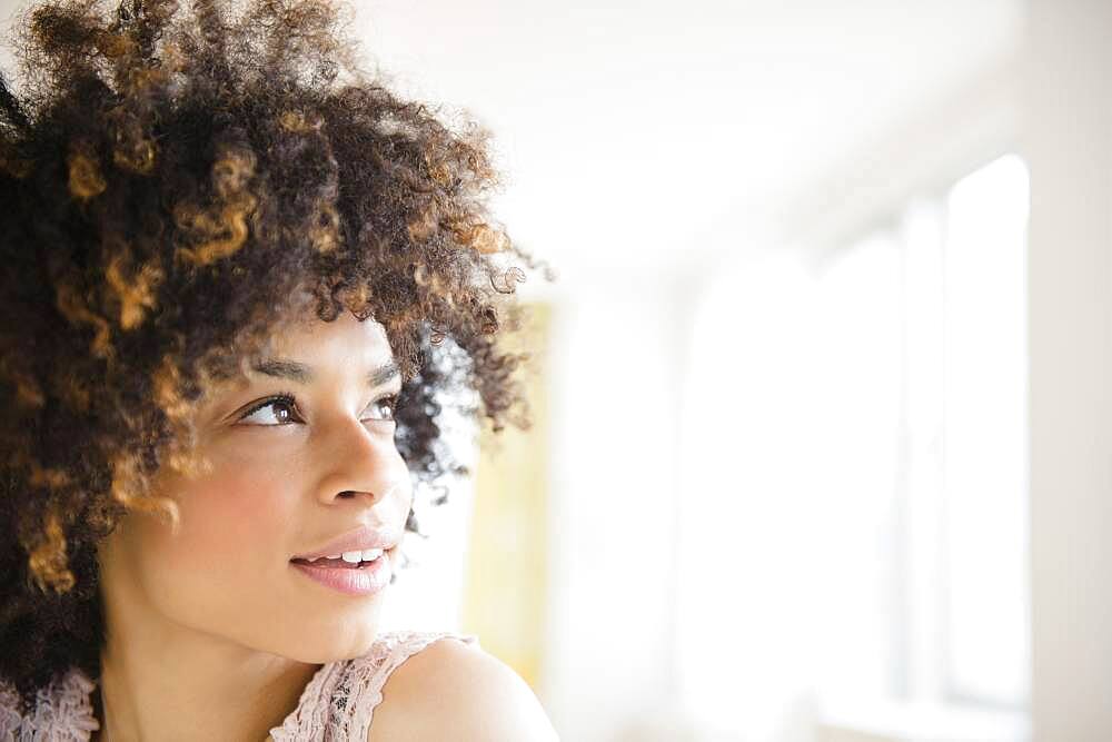 Mixed race woman looking up