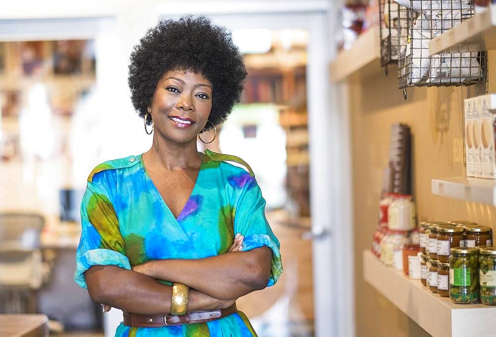 African American business owner smiling in store