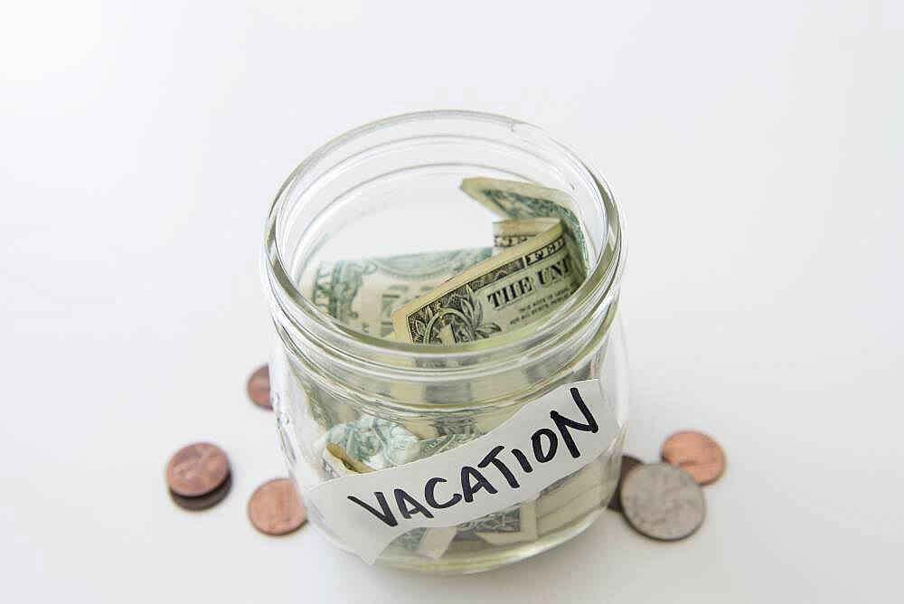 Close up of vacation savings jar