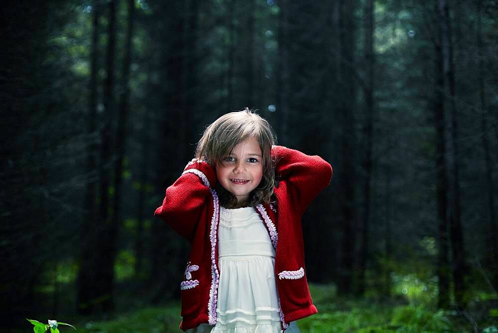 Caucasian girl smiling in forest