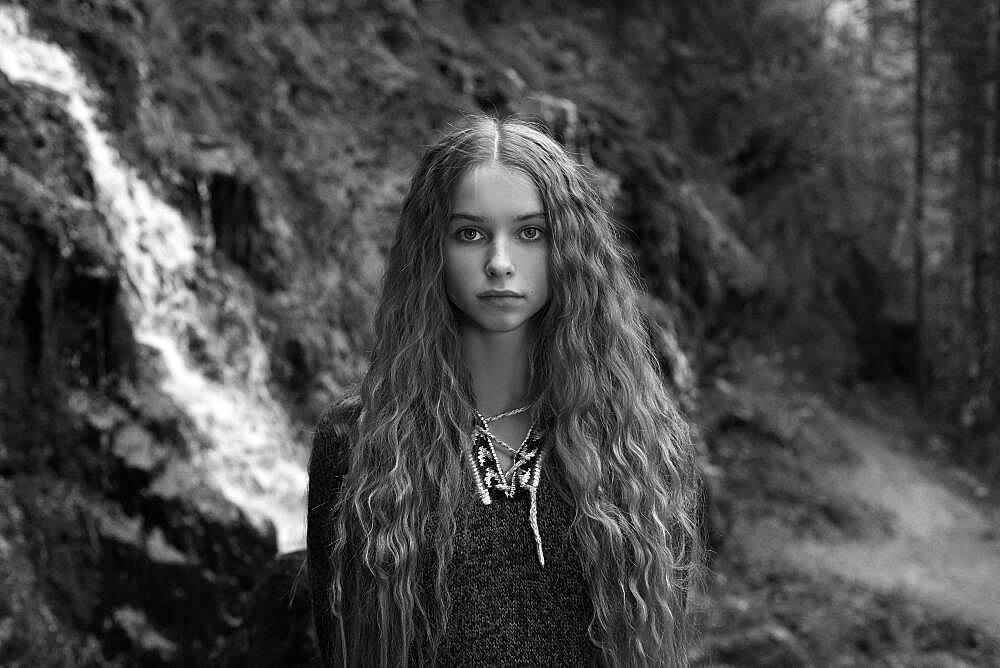 Caucasian teenage girl in forest