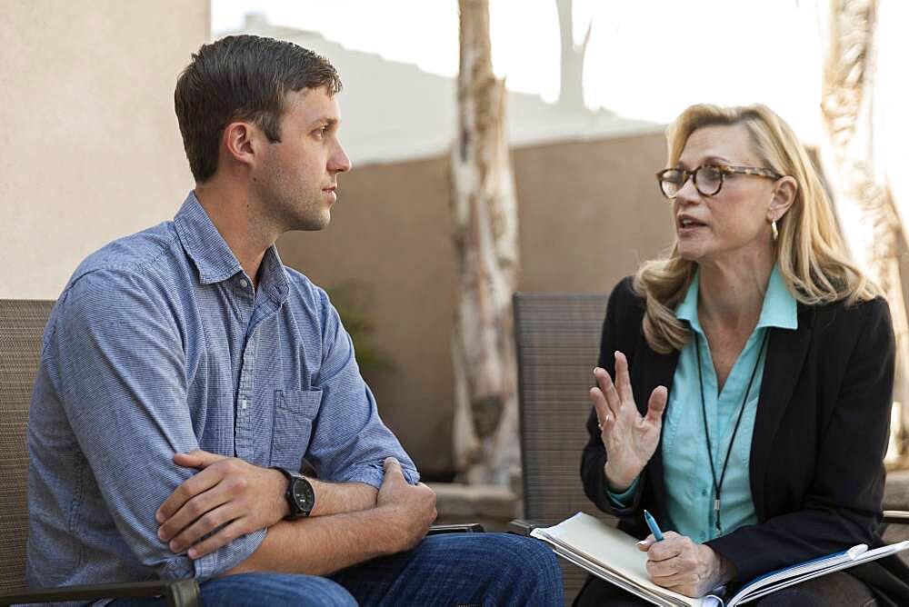 Man talking with therapist in therapy