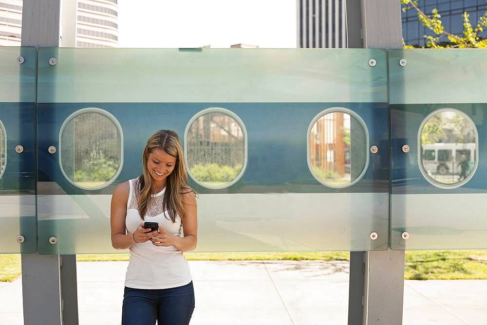 Caucasian woman using cell phone