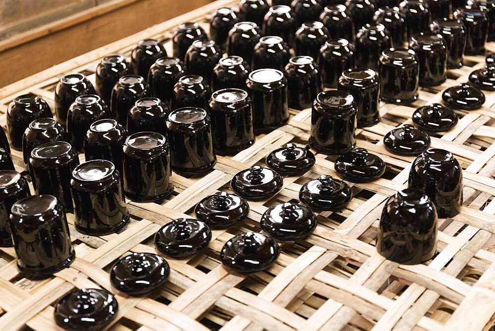 Traditional lacquerware drying on rack