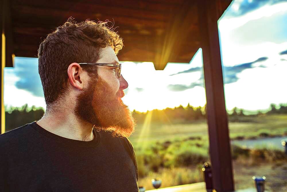 Caucasian man admiring view of remote landscape