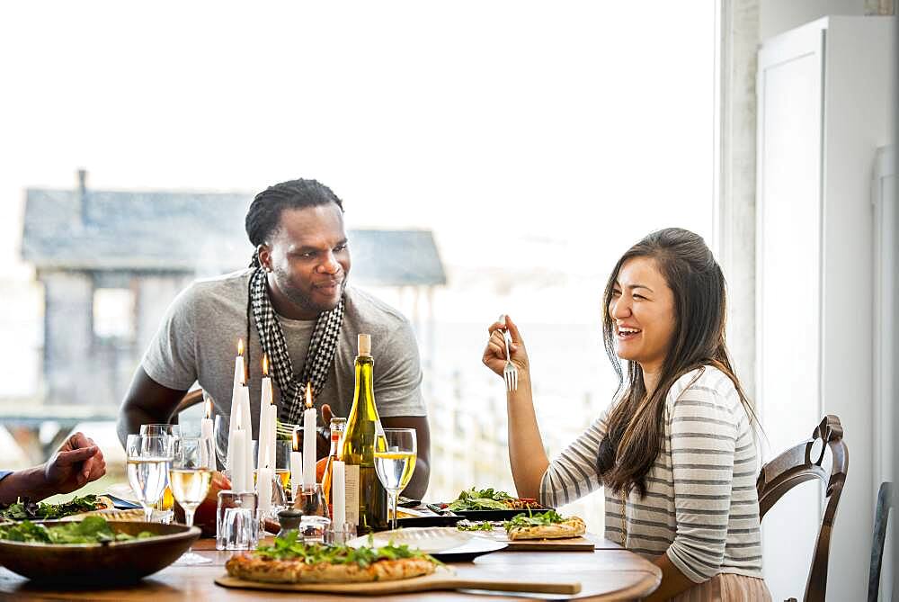 Couple talking at dinner party