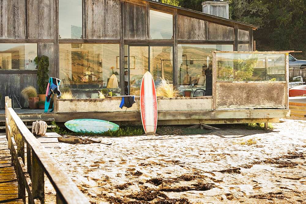 Surfboards in backyard of beach house