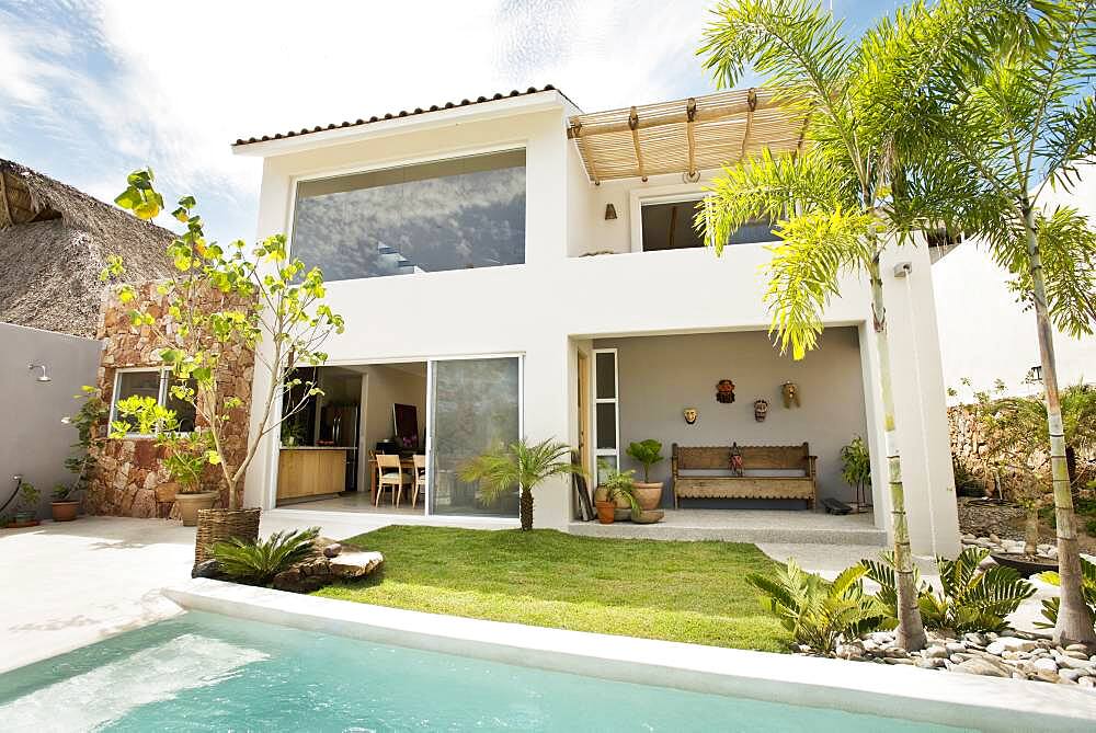 Swimming pool in backyard of modern home