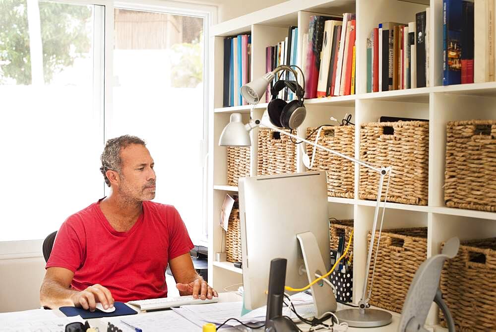 Hispanic man working in home office