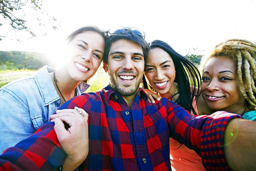 Friends taking selfie outdoors