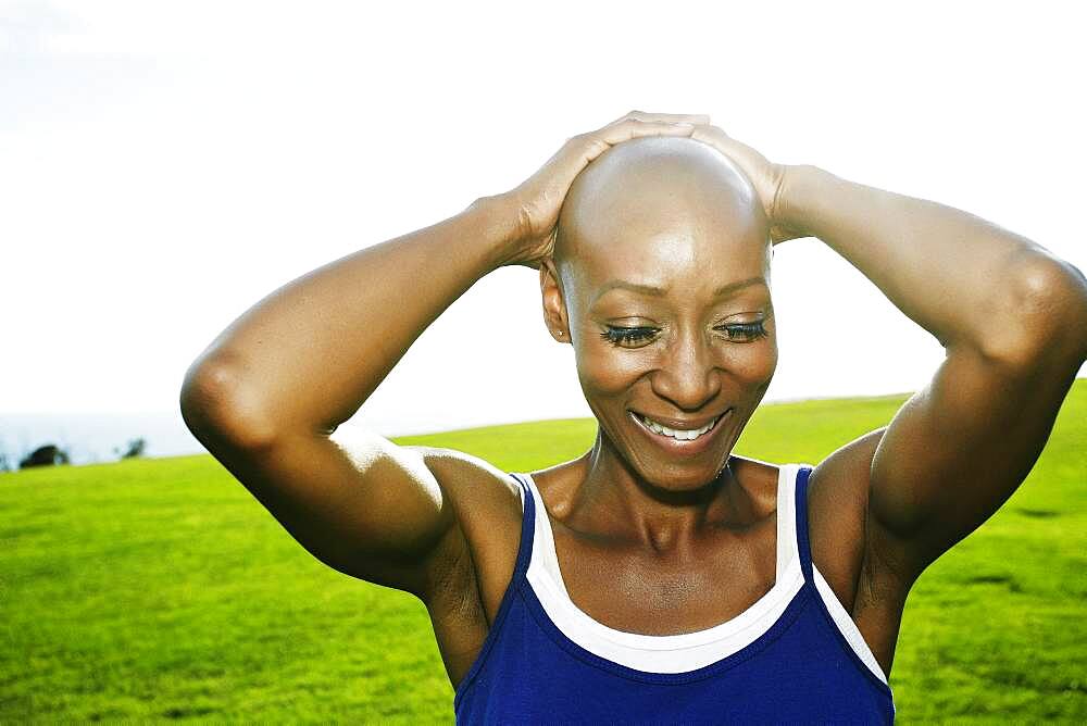 African American woman smiling in park