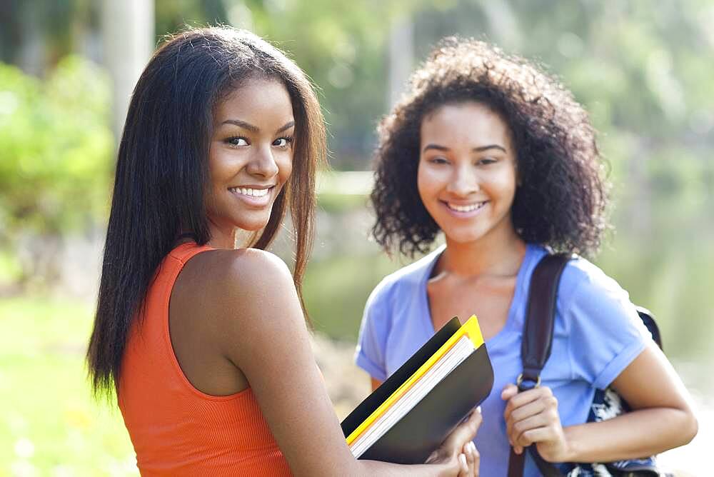 Black students smiling outdoors