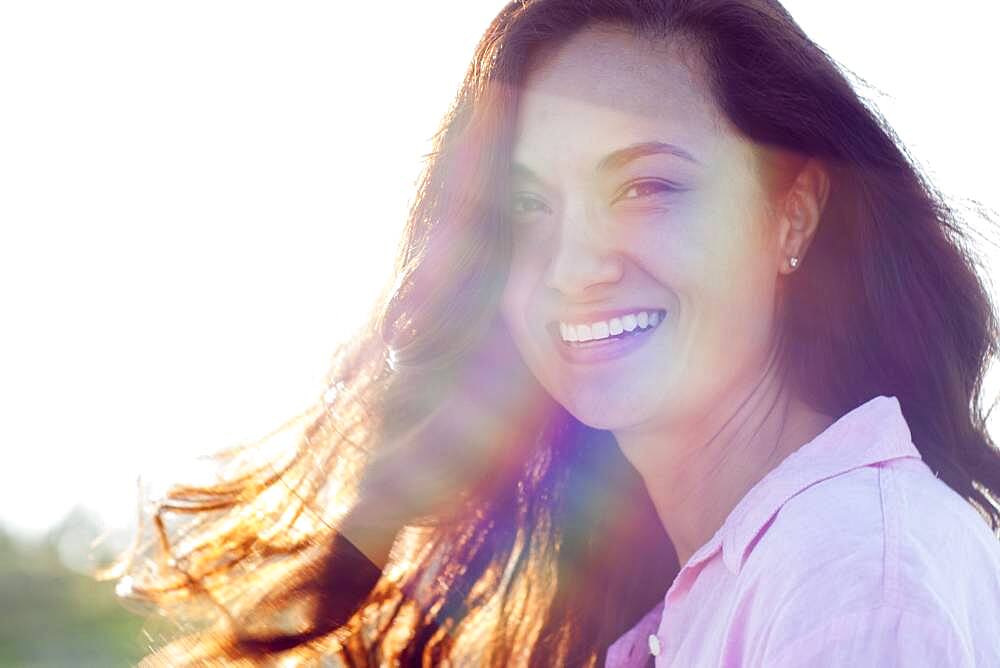 Mixed race woman smiling outdoors