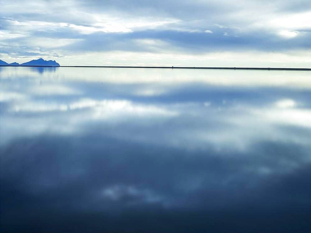 Reflection of clouds in still water