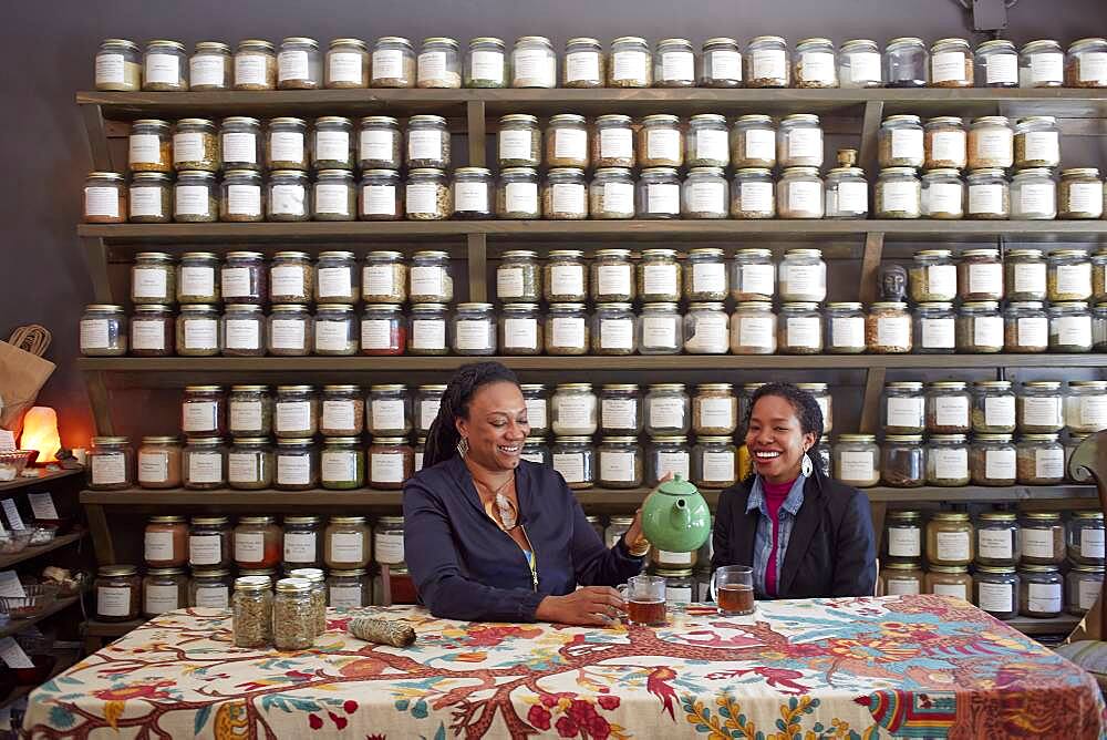 Black women drinking tea in tea shop