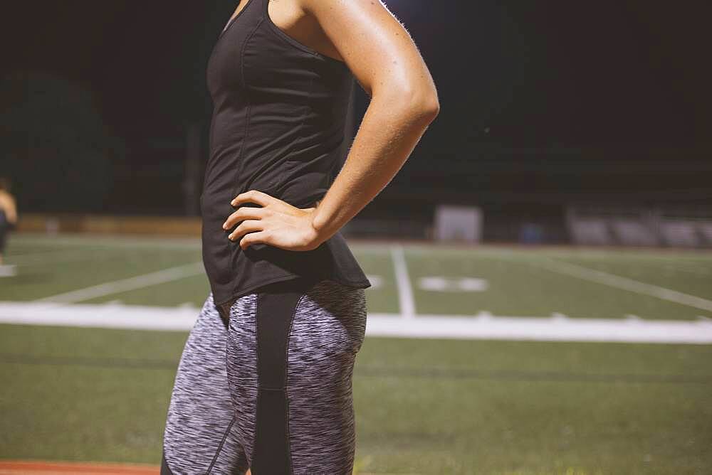 Caucasian athlete standing on sports field