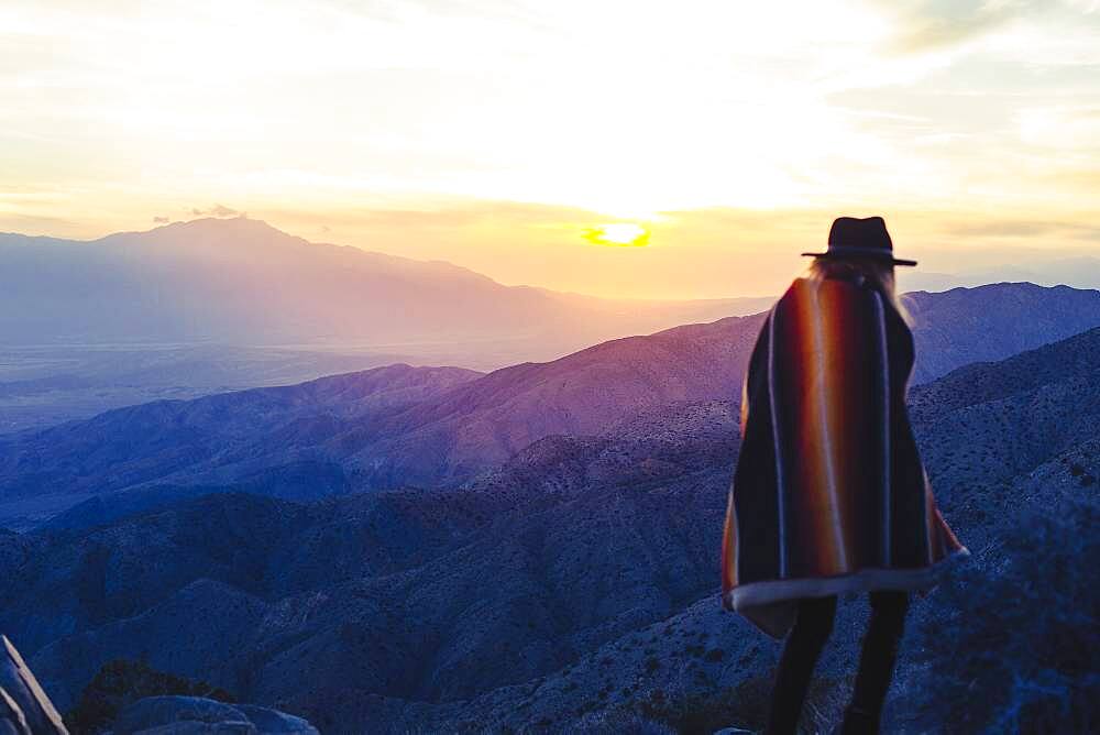 Caucasian woman overlooking remote desert landscape