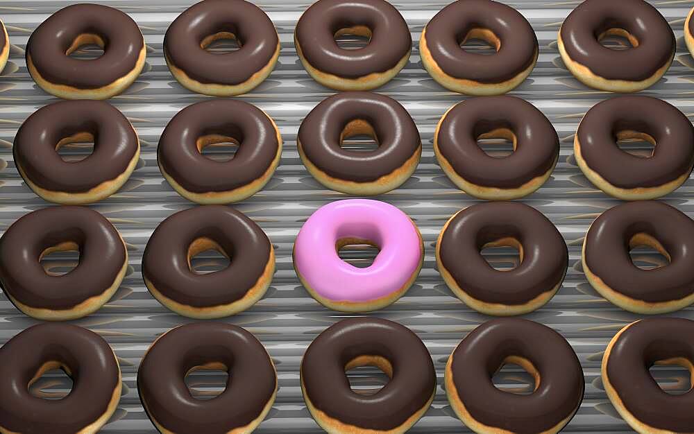 Close up of frosted donuts on baking pan