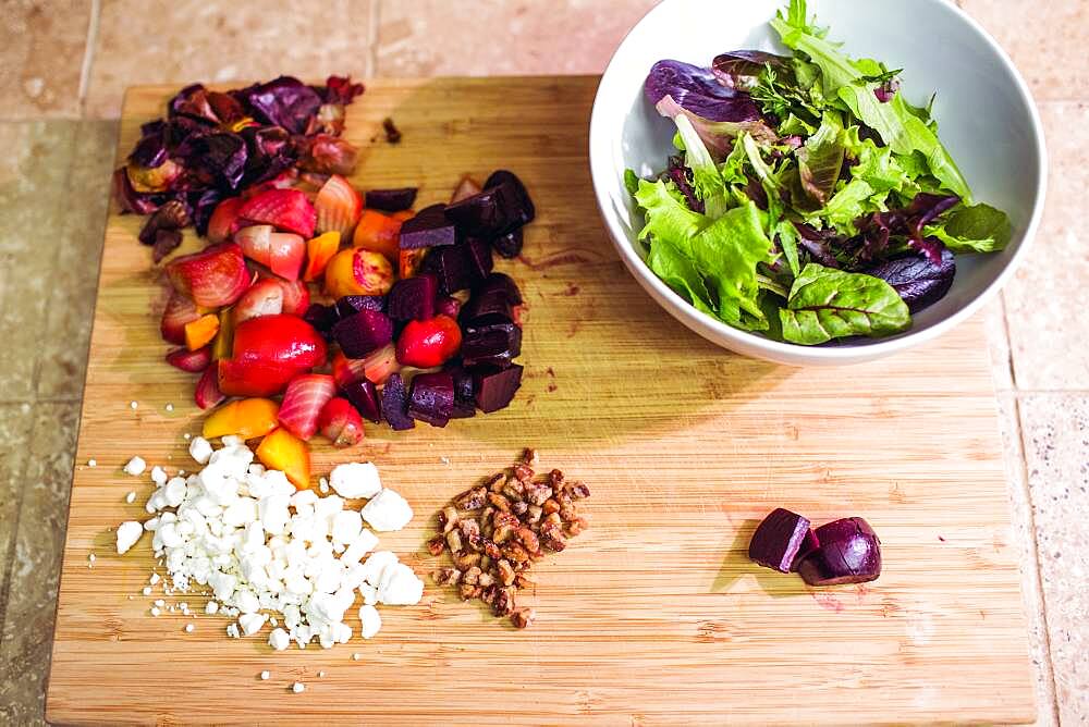 Chopped fruit, nuts and cheese with salad bowl