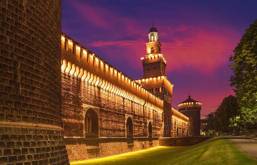 Illuminated tower and castle walls, Milano, Lombardia, Italy