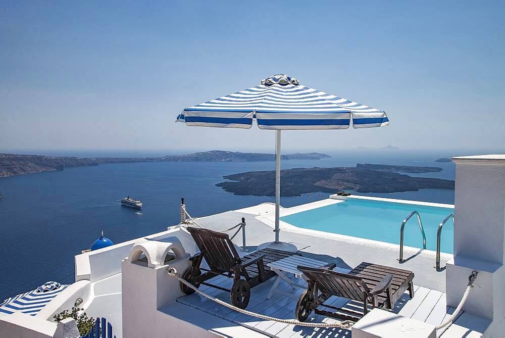 Lawn chairs and swimming pool on hilltop