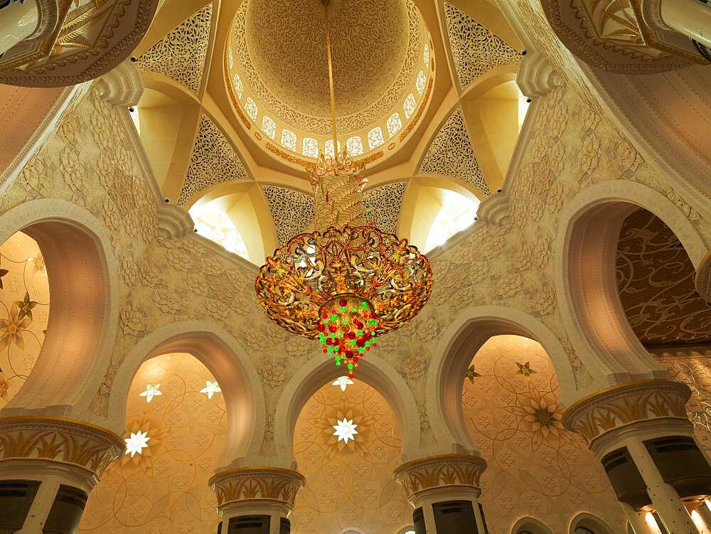 Low angle view of chandelier in ornate dome, Abu Dhabi, Abu Dhabi Emirate, United Arab Emirates